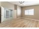 Neutral bedroom features wood floors and an open entry to a second room at 368 Legacy Dr, Henderson, NV 89014