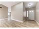 View of the bright entryway featuring wood-look floors and neutral paint at 368 Legacy Dr, Henderson, NV 89014