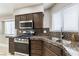 Gourmet kitchen featuring stainless steel appliances, granite counters, and ample natural light at 368 Legacy Dr, Henderson, NV 89014