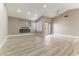 Bright living room with wood flooring, modern fireplace, and sliding glass door at 368 Legacy Dr, Henderson, NV 89014