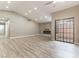 Bright living room with recessed lights, wood-look flooring, and access to a patio at 368 Legacy Dr, Henderson, NV 89014