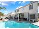 Backyard pool with covered patio, BBQ, and lush landscaping at 3695 Funston Way, Las Vegas, NV 89129