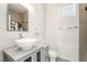 Bathroom featuring a vessel sink, modern fixtures, and tiled walls at 3695 Funston Way, Las Vegas, NV 89129