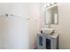 Bathroom with a vessel sink on a gray vanity, mirror, and modern fixtures at 3695 Funston Way, Las Vegas, NV 89129