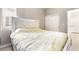 Bedroom featuring a bed with white headboard near a window and closet at 3695 Funston Way, Las Vegas, NV 89129