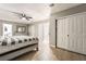 Bright bedroom with ceiling fan and natural light from the windows at 3695 Funston Way, Las Vegas, NV 89129