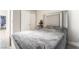 Bedroom featuring a bed with white headboard, closet and Christmas tree at 3695 Funston Way, Las Vegas, NV 89129