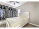 Bedroom with an ornate headboard and unique curtains, offering a relaxing ambiance at 3695 Funston Way, Las Vegas, NV 89129