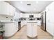 Modern kitchen with stainless steel appliances, all-white cabinetry, and center island at 3695 Funston Way, Las Vegas, NV 89129