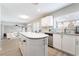 Updated kitchen features sleek countertops, a central island, and stainless steel appliances at 3695 Funston Way, Las Vegas, NV 89129