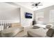 Bright living area with modern furnishings, TV, and ample natural light at 3695 Funston Way, Las Vegas, NV 89129