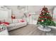 Spacious living room with vaulted ceilings, neutral paint, and a Christmas tree at 3695 Funston Way, Las Vegas, NV 89129