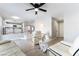 Bright living room with a modern sofa, glass table, and open floor plan at 3695 Funston Way, Las Vegas, NV 89129