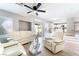 Spacious living room with modern furnishings, ceiling fan, and an open layout at 3695 Funston Way, Las Vegas, NV 89129