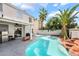 Backyard pool with palms, and covered patio for entertaining at 3695 Funston Way, Las Vegas, NV 89129