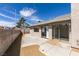 Backyard featuring a concrete patio and gravel landscaping at 3800 Summer Breeze Cir, Las Vegas, NV 89108