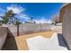 Wide shot of the private backyard with gravel landscaping and concrete patio at 3800 Summer Breeze Cir, Las Vegas, NV 89108