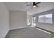 Bedroom with carpet, large window, and sliding glass door to the backyard at 3800 Summer Breeze Cir, Las Vegas, NV 89108