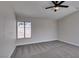 Bedroom with carpet and a large window offering backyard views at 3800 Summer Breeze Cir, Las Vegas, NV 89108