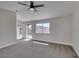 Bedroom with carpet, large window, and sliding glass door to the backyard at 3800 Summer Breeze Cir, Las Vegas, NV 89108