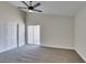 Bedroom with neutral walls, closet, ceiling fan, and sliding glass door at 3800 Summer Breeze Cir, Las Vegas, NV 89108
