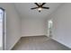 Neutral bedroom with gray carpet, ceiling fan, and access to a bathroom at 3800 Summer Breeze Cir, Las Vegas, NV 89108