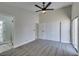 This cozy bedroom boasts soft gray carpet, closet and ensuite bathroom at 3800 Summer Breeze Cir, Las Vegas, NV 89108