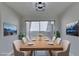 Bright dining room with sliding glass doors leading to the backyard at 3800 Summer Breeze Cir, Las Vegas, NV 89108