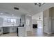 Modern kitchen with stainless steel appliances, white cabinets, and view into the living room at 3800 Summer Breeze Cir, Las Vegas, NV 89108