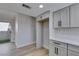 Bright kitchen with white cabinets, stainless steel appliances, and easy access to the patio at 3800 Summer Breeze Cir, Las Vegas, NV 89108
