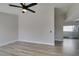 Bright living area featuring wood-look floors and ceiling fan at 3800 Summer Breeze Cir, Las Vegas, NV 89108
