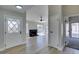 Bright living room featuring wood-look floors, fireplace and natural light at 3800 Summer Breeze Cir, Las Vegas, NV 89108