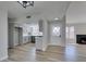 Open-concept living room with fireplace, neutral paint, new flooring, and updated kitchen view at 3800 Summer Breeze Cir, Las Vegas, NV 89108