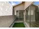 Enclosed patio with direct access to indoor living space with artifical turf at 3800 Summer Breeze Cir, Las Vegas, NV 89108