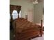 Bedroom featuring a wooden bedframe, carpet flooring, and neutral colored walls at 3987 Saddlewood Ct, Las Vegas, NV 89121