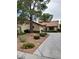 Charming single-story home features desert landscaping and a large shade tree at 3987 Saddlewood Ct, Las Vegas, NV 89121