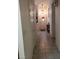 A hallway leading to the front door is illuminated by a hanging light fixture at 3987 Saddlewood Ct, Las Vegas, NV 89121