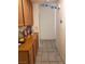 A hallway with tiled flooring with built-in wooden cabinets runs down the left wall at 3987 Saddlewood Ct, Las Vegas, NV 89121