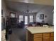 Spacious living room features high ceilings, a ceiling fan, and a fireplace at 3987 Saddlewood Ct, Las Vegas, NV 89121