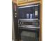 This kitchen features an older black oven/microwave combo with chrome accents at 3987 Saddlewood Ct, Las Vegas, NV 89121