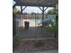 Community pool area featuring a gated entry and seating, perfect for relaxation at 3987 Saddlewood Ct, Las Vegas, NV 89121