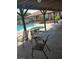 Relaxing poolside patio with outdoor seating and a sparkling pool at 3987 Saddlewood Ct, Las Vegas, NV 89121