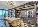 Modern bar area featuring marble countertops, gold stools, and drink dispenser at 4471 Dean Martin Dr # 4001, Las Vegas, NV 89103
