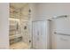 Modern bathroom featuring a glass-enclosed shower with marble tile and a built-in linen cabinet at 4471 Dean Martin Dr # 4001, Las Vegas, NV 89103