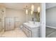 Bright bathroom featuring a double vanity, large mirror, and glass-enclosed shower at 4471 Dean Martin Dr # 4001, Las Vegas, NV 89103