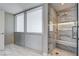 Bathroom featuring marble floors and shower with bench and rainfall shower head at 4471 Dean Martin Dr # 4001, Las Vegas, NV 89103