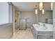 Bathroom featuring a double vanity, large mirror, and glass-enclosed shower at 4471 Dean Martin Dr # 4001, Las Vegas, NV 89103