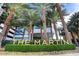 Elegant building signage for The Martin surrounded by lush greenery and palm trees at 4471 Dean Martin Dr # 4001, Las Vegas, NV 89103