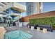 Luxury outdoor hot tub with a built-in grill station and comfortable lounge area at 4471 Dean Martin Dr # 4001, Las Vegas, NV 89103