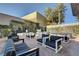 Inviting outdoor seating area with modern furniture, lush greenery, and gravel groundcover at 4471 Dean Martin Dr # 4001, Las Vegas, NV 89103